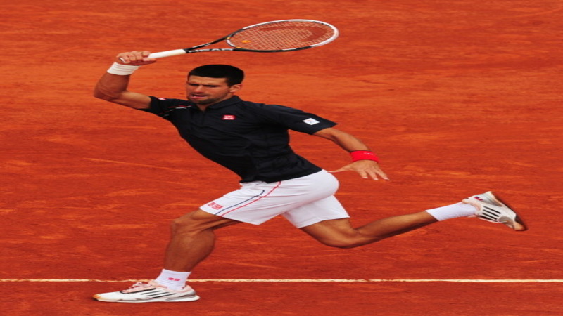 Djokovic Fights Back To Progress