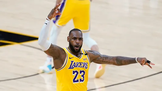LeBron James celebrates his 3-pointer against the Phoenix Suns during the second half, first-round playoff series Tuesday, May 25, 2021, in Phoenix. Lakers won 109-102.