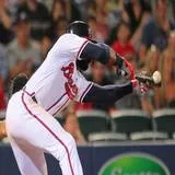 A player bunts for a pop out