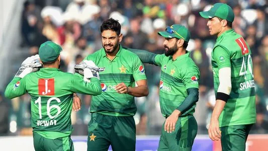 Pakistan's Haris Rauf (2L) celebrates with teammates the wicket of Bangladesh's Mahmudullah Riyad during the second T20 international cricket match